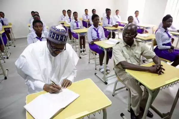 Caption This Photo Of President Buhari And Oshiomhole Sitting In A Classroom